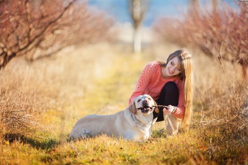 Girl playing with her dog