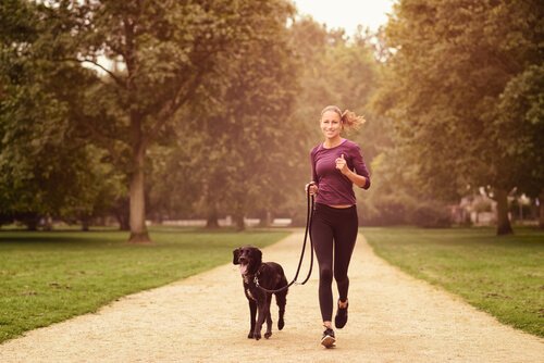 Woman running with her dog