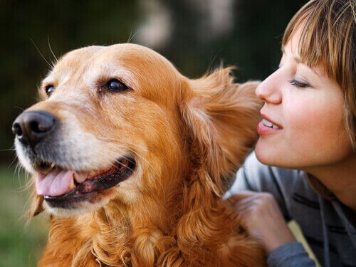 A woman talking to her dog.