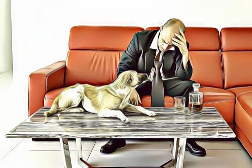 A distressed man sitting on a couch.