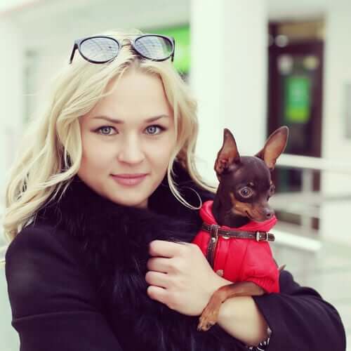 A picture of a dog and its owner.