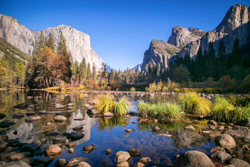 A rocky body of water in the mountains.