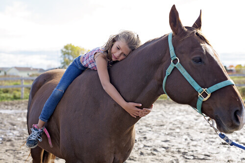 A girl riding a horse.