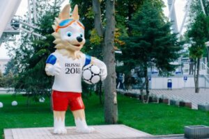 Russia's wolf mascot holding a soccer ball.